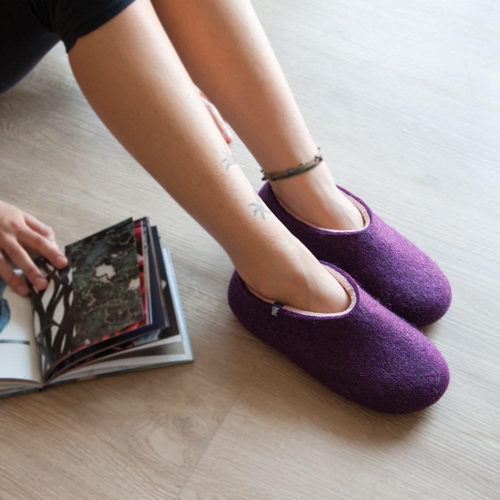 Lady wearing aubergine slippers from the new Dual Purple Wooppers collection