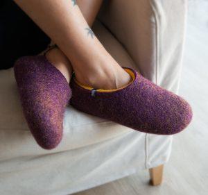 Lady wearing wool clogs purple and yellow by Wooppers felted slippers / autumn slippers