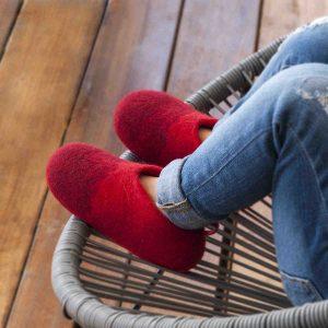 Girl wearing girls wool slippers in red