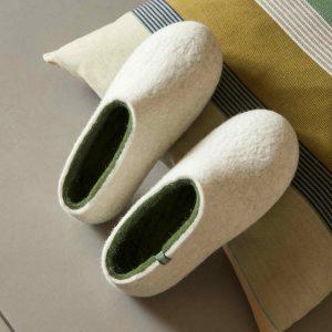 Flat slippers ARIA white & olive green on a pillow