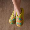 Child wearing wool slippers, lime with colorful confetti decoration by Wooppers