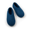 A pair of blue wool felt slippers closed at the front and high at the heel.