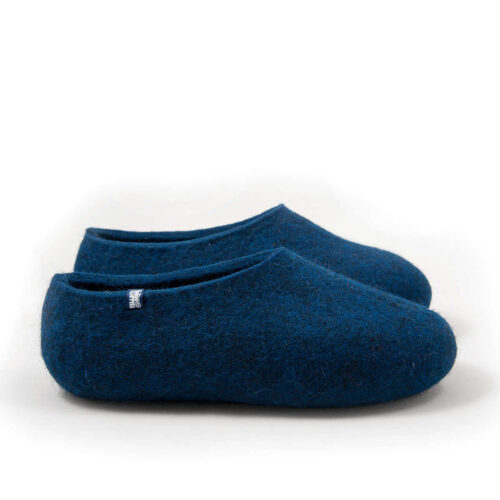 A pair of felted wool slippers in aquamarine blue, in a continuous shape seen from the right side