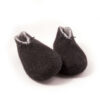 BOOTIE black white-e A pair of felted wool black booties for indoors use. The interior is white. They feature a leather tag on the side of the right shoe and tie elastic laces. Front view.