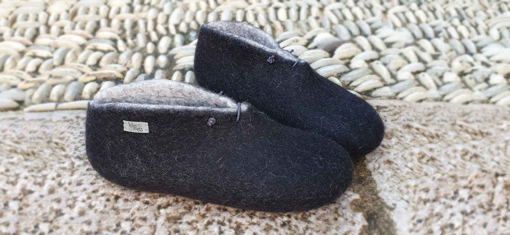 Black Booties on pebbles