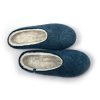 Top view of the best slippers in wool from the Colori collection by Wooppers. The slippers are felted in white and petrol blue wool and are cut either high or low at the back according to customer's taste. This pair is cut low.