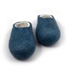 Front view of the best slippers in wool from the Colori collection by Wooppers. The slippers are felted in white and petrol blue wool and are cut either high or low at the back according to customer's taste. This pair is cut low.