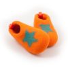 Wool slippers for kids made of felt wool that look like a shoe. They are orange and have a turquoise decorative star at their front part.