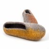 Wool slippers from the SEASONS collection by Wooppers. The shoes are felted in grey wool with a stylish cut at the opening and different colors on the side of each shoe - yellow for the right and brown for the left.