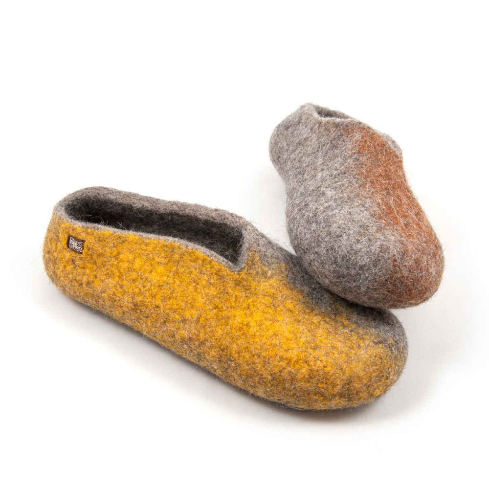 Stylish ladies' slippers from the SEASONS collection by Wooppers. They are grey with colors on the outer side of the shoe. The left shoe with blown on the side rests on the right one with yellow on its side.