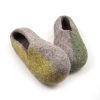 Handmade wool slippers in spring colors from the SEASONS collection by Wooppers. We can see the lime green color on the side of the right shoe as it rests on the left one which has green on its left side.