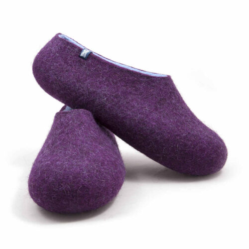 A pair of purple wool slippers, baby blue on the inside one shoe which we see from its right side rests on top of the other.