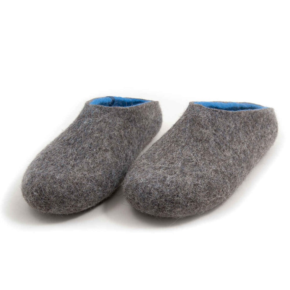 Felted wool house slippers Grey with blue interior. Seen from the front this pair has a low cut at the back. Felt wool shoes by Wooppers.
