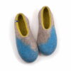 AMIGOS blue natural lime felt wool slippers by Wooppers -a A pair of house shoes for women made of felt wool (slip-on, closed-back, low-cut ankle) seen from above mottled grey with bright blue in the area of the toes and lime green on the inside. The whole shoe is one continuous piece of felt - no stitches.