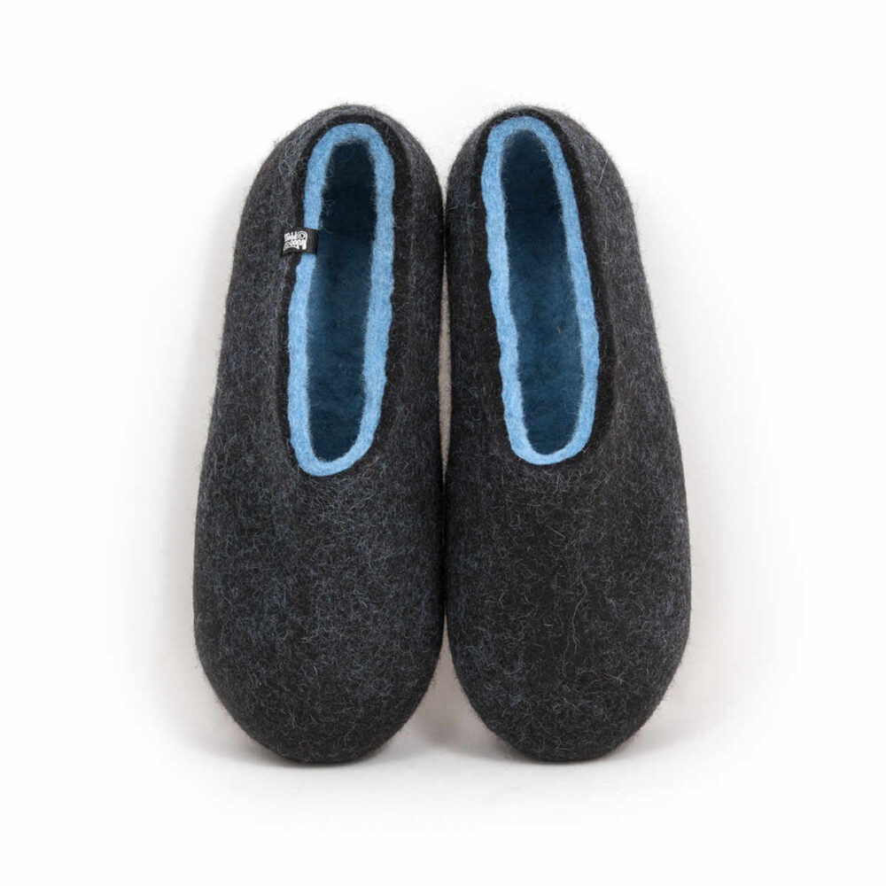 A pair of black wool slipper shoes with light blue on the inside. Seen from the top.