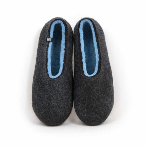 A pair of black wool slipper shoes with light blue on the inside. Seen from the top.