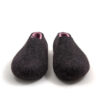 DUAL black pink_b A pair of wool house slippers with pink on the inside. Seen from the front.