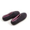 DUAL black pink_e A pair of wool house slipper shoes with pink on the inside. Elevated back view.