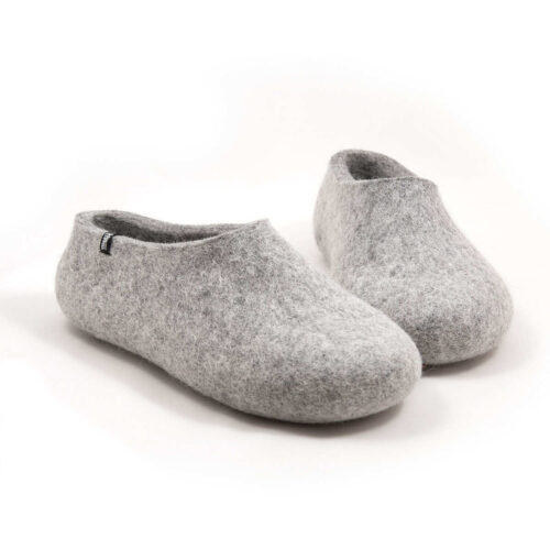 A pair of light mottled grey slippers in felted wool.